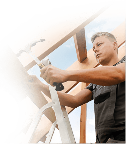 Man hammers wood on a roof. | The Bearded Contractor