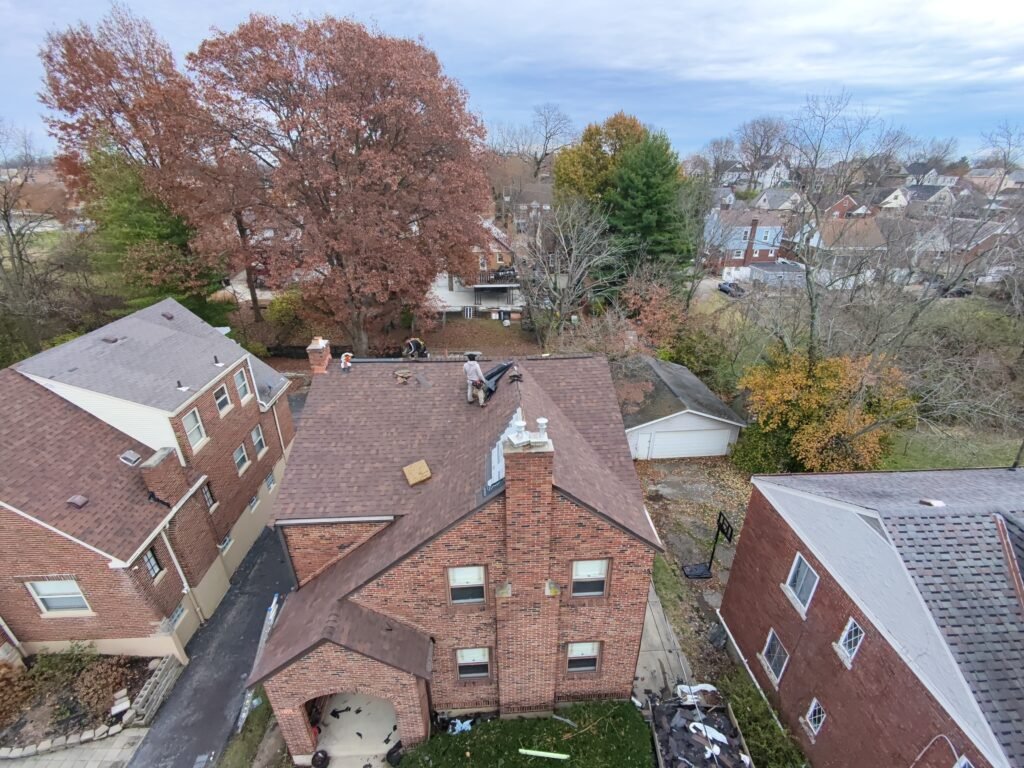 Roofers installing shingles on house. | The Bearded Contractor